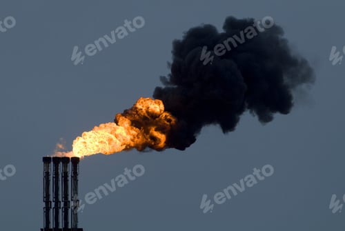 Preview: Fire pouring from industrial smokestacks