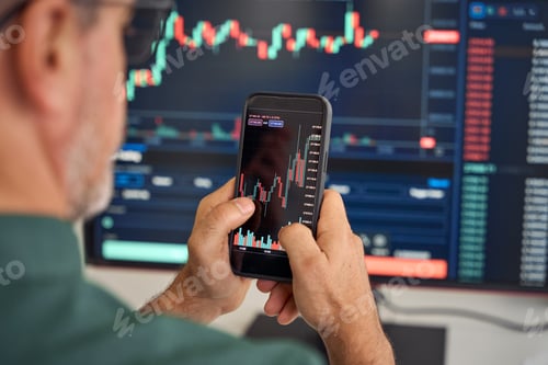 Preview: Investor trader analyzing crypto stock trade invest mobile market. Over shoulder