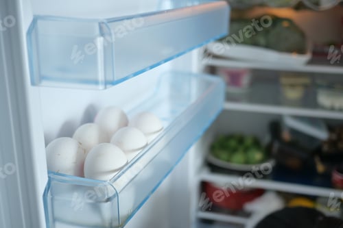 Preview: eggs in a fridge with copy space