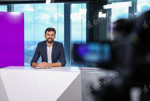 Preview: Presenter and video camera operator working in studio. News broadcasting