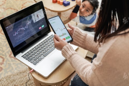 Preview: Trader mother studying stock market on stream lesson with her child at home - Blockchain analysis