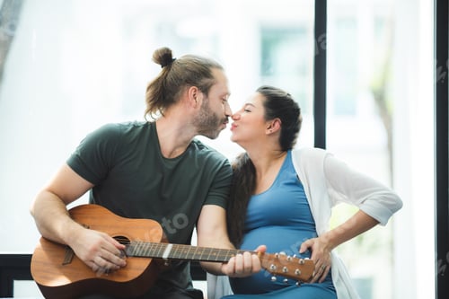 Preview: Husband plays guitar for pregnant wife at home