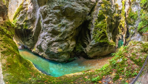 Preview: Tolmin gorges presenting stunning emerald green soca river flowing through canyon in slovenia