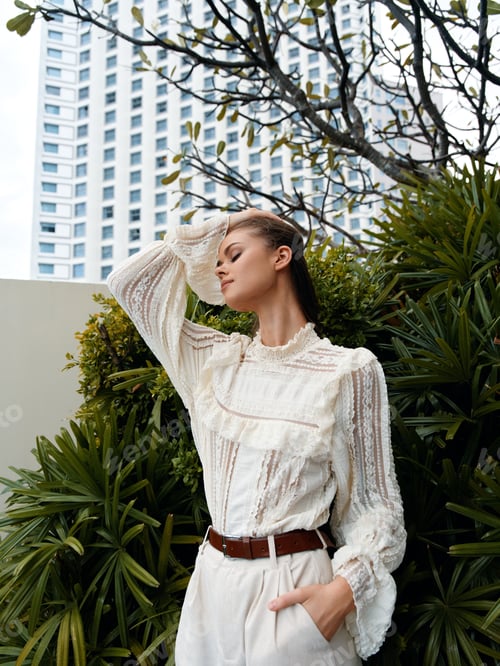 Preview: Stylish Summer Portrait: Pretty Young Female Model Posing Outdoors in a Green City Garden