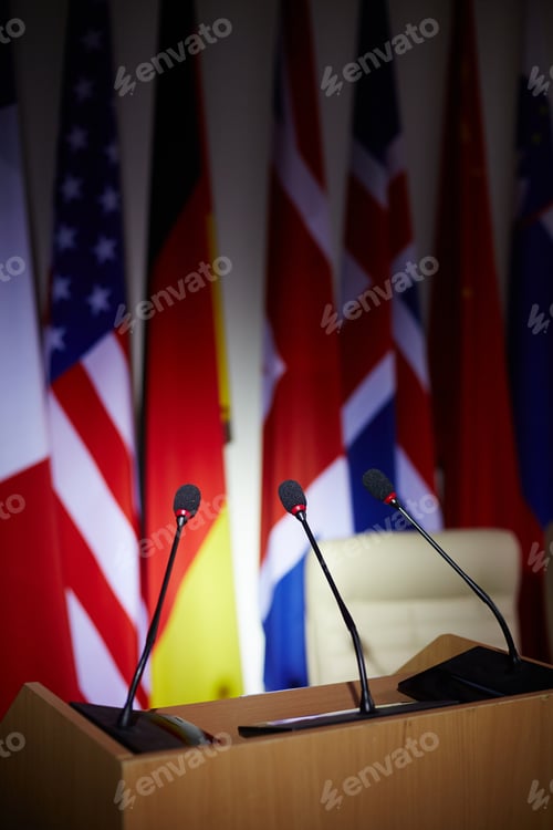Conference Table with Multiple Microphones and Flags