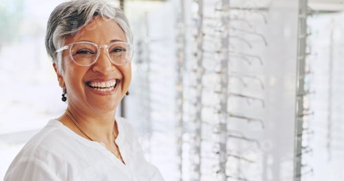 Preview: Glasses, portrait and smile with woman in store for eye care, healthcare and optometry. Shopping, l