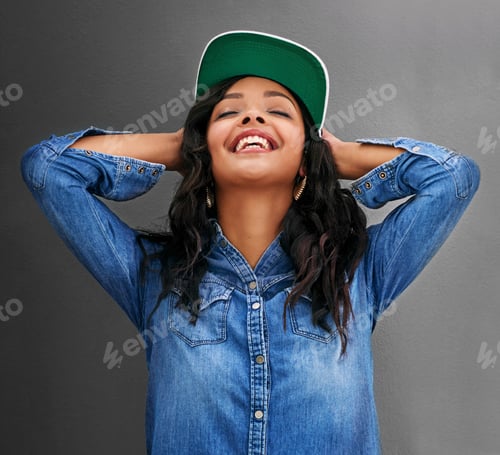 Preview: Studio shot of an attractive young woman posing against a gray background
