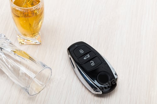 Preview: Car key on the bar with spilled alcohol