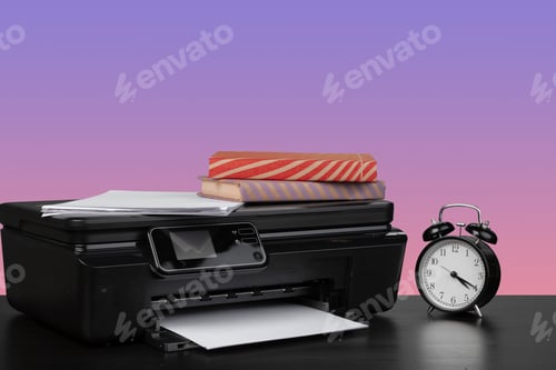 Preview: Home laser printer on desk against purple background