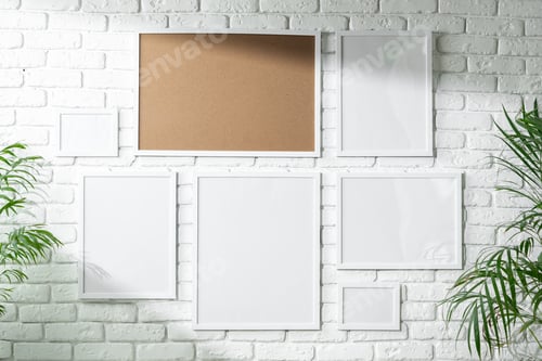 Preview: Varied Sized Photo Frames Displayed on a White Brick Wall