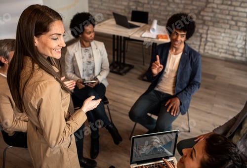 Preview: Group of diverse group of business people having a meeting while sitting in circle.