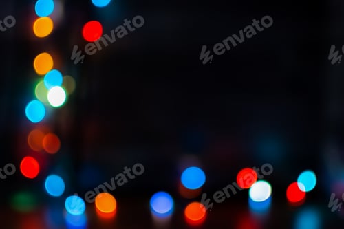 Preview: Multi-colored bokeh on a black background.