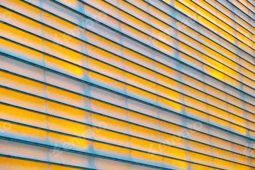 Preview: Background of yellow symmetrical lines with real lighting on a wall