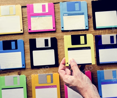 Preview: Hand holding floppy disk drive data storage