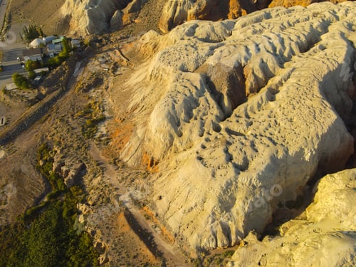 Preview: Close-up aerial view of severely eroded yellow clay formations