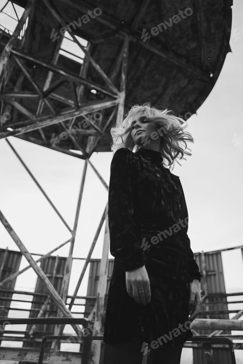 Preview: Romantic and beautiful caucasian woman in stylish clothes on the rooftop enjoying herself.