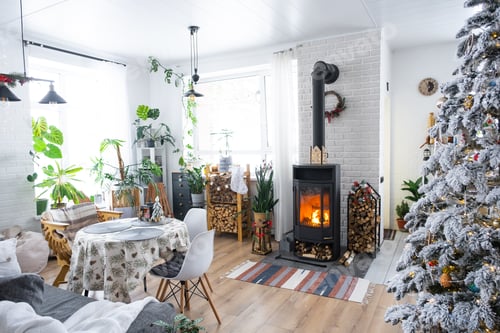 Preview: Festive white modern interior of house is decorated for Christmas and New Year in loft style with bl