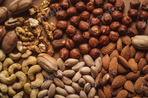 Preview: flat lay with tasty nuts arrangement on brown background