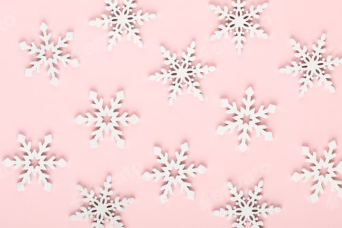 Preview: Christmas background. White snow decorations on a pink background.