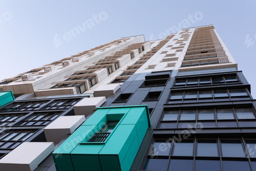 Preview: stylish residential apartment building against the blue sky bottom view