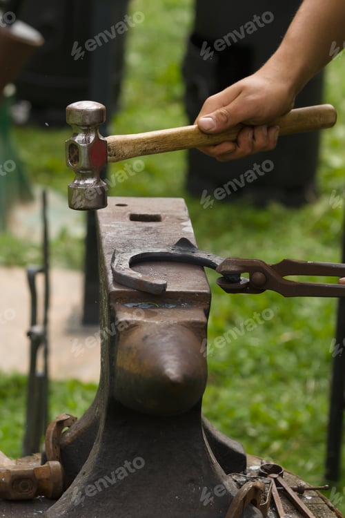 Preview: Farrier Making a Horsehoe on an Anvil