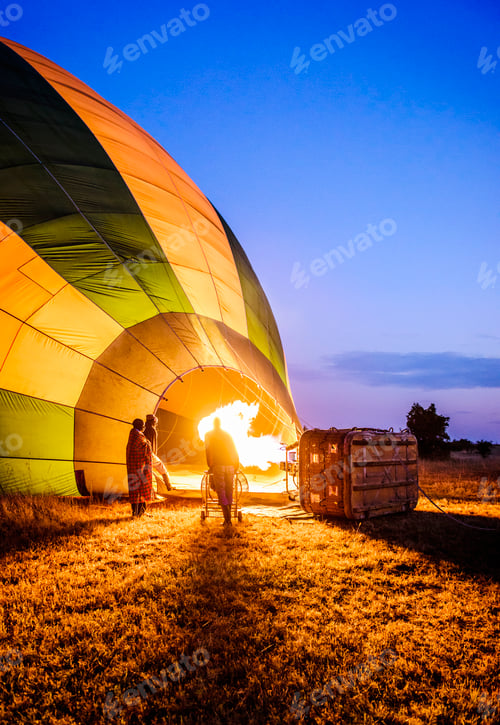 Preview: Hot air balloon inflating in rural field
