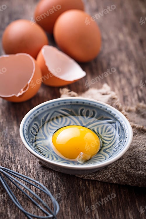 Preview: Raw chicken eggs and whisk