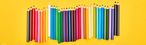 Preview: Panoramic shot of color pencils set isolated on yellow