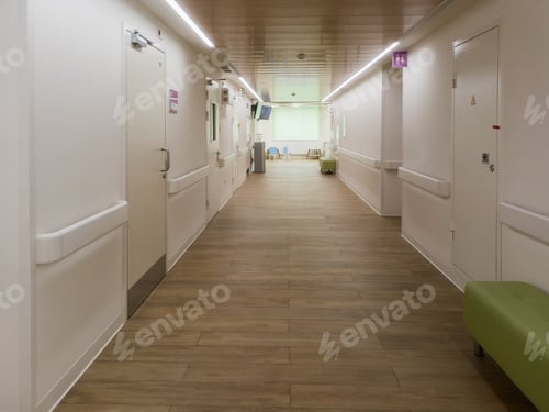 Preview: Modern hospital corridor with wood floor and calm waiting area shows clean healthcare interior