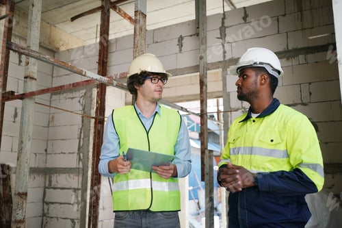 Preview: Architect and construction engineer or surveyor discussion plans and blueprints