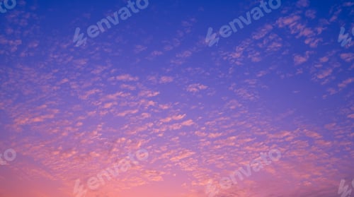 Preview: Colorful evening sky with many fluffy clouds on beautiful romantic pastel pink and blue sunset sky