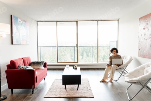 Preview: Curly middle eastern student woman studying, preparing for exam, using laptop