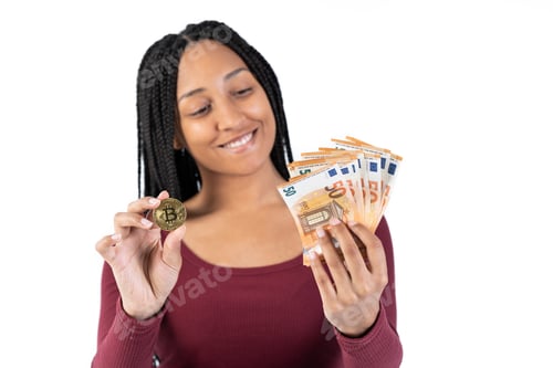 Preview: Black woman with some fifty euro bills shows a bitcoin on a white background