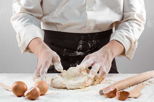 Preview: Hands kneading a dough