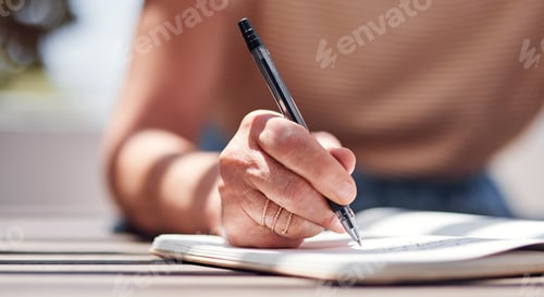 Preview: Cropped shot of an unrecognizable senior woman writing in her book outside on the balcony at home