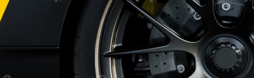 Preview: KYIV, UKRAINE - OCTOBER 7, 2019: panoramic shot of black car wheel in porshe