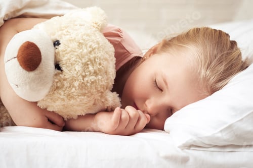Preview: Cute little child girl sleeping with teddy bear