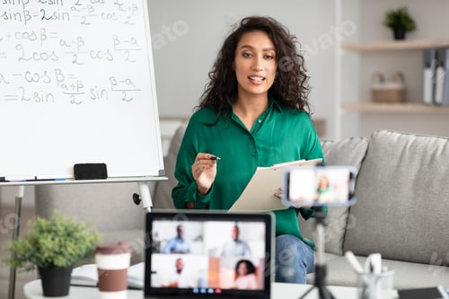 Preview: Female teacher explaining math online making video call