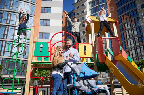 Preview: Big family spending time together on playground.