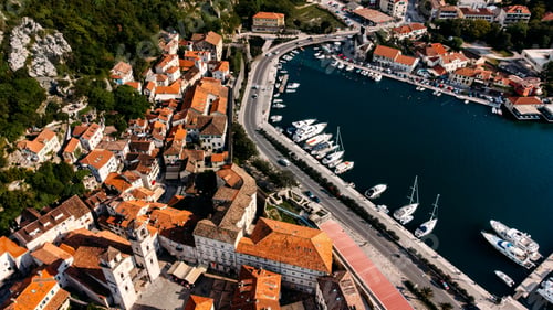 Preview: Kotor, Montenegro. Drone view on Kotor Bay. Yachts and old medieval houses near mountains and sea.