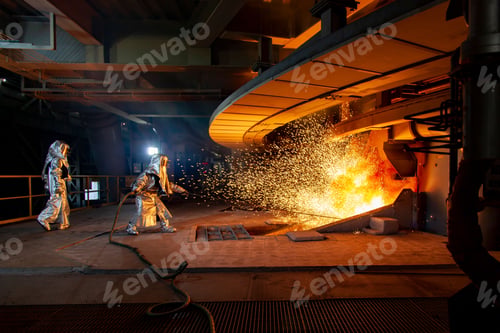 Preview: Two factory workers igniting a furnace in an industrial factory.