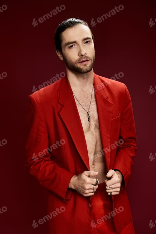 Preview: The dapper gentleman: a man in a red suit striking a pose