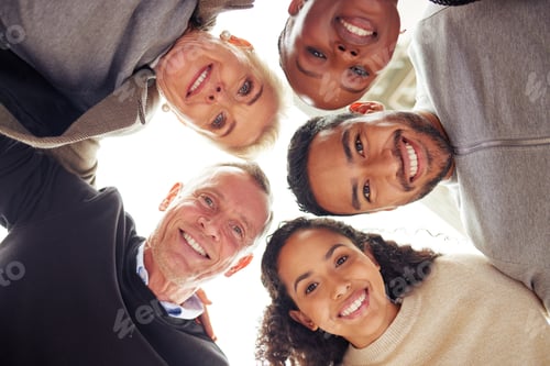 Preview: Portrait of a group of businesspeople standing together in a huddle