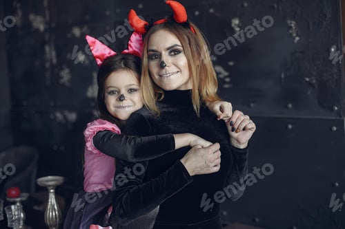 Preview: Mother with daughter in a halloween costume and makeup