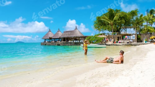 Preview: Man and Woman on a tropical beach in Mauritius, a couple on honeymoon vacation in Mauritius
