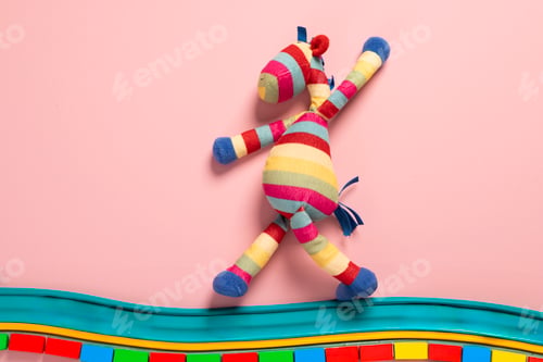 Preview: Soft plush zebra toy on a pink background with space for your text