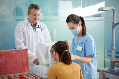 Preview: Medical Team Using Autorefractor