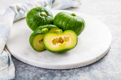 Preview: Close-up of zucchiolo, fresh summer vegetable, hybrid of zucchini and cucumber