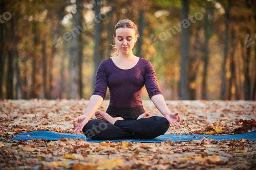 Preview: Beautiful young woman meditates in yoga