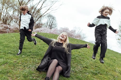 Preview: Cheerful mother and kids in park